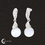 Lumière douce et éclatante des Boucles d'oreilles Pierre de Lune (Crystalline).