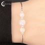 Bracelet Pierre de Lune (Anna) en argent 925 rhodié avec trois perles de tailles différentes (8mm et 6mm).