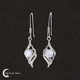 Bijou femme : Boucles d'oreilles (Odéone) avec petites pierres de lune facettées.